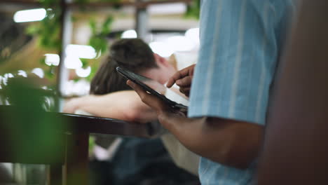 vista glimpse of tablet screen illuminated by soft ambient light fingertip tapping vibrant icons on touchscreen interface gentle motion highlighting intuitive digital interaction amid soft indoor blur