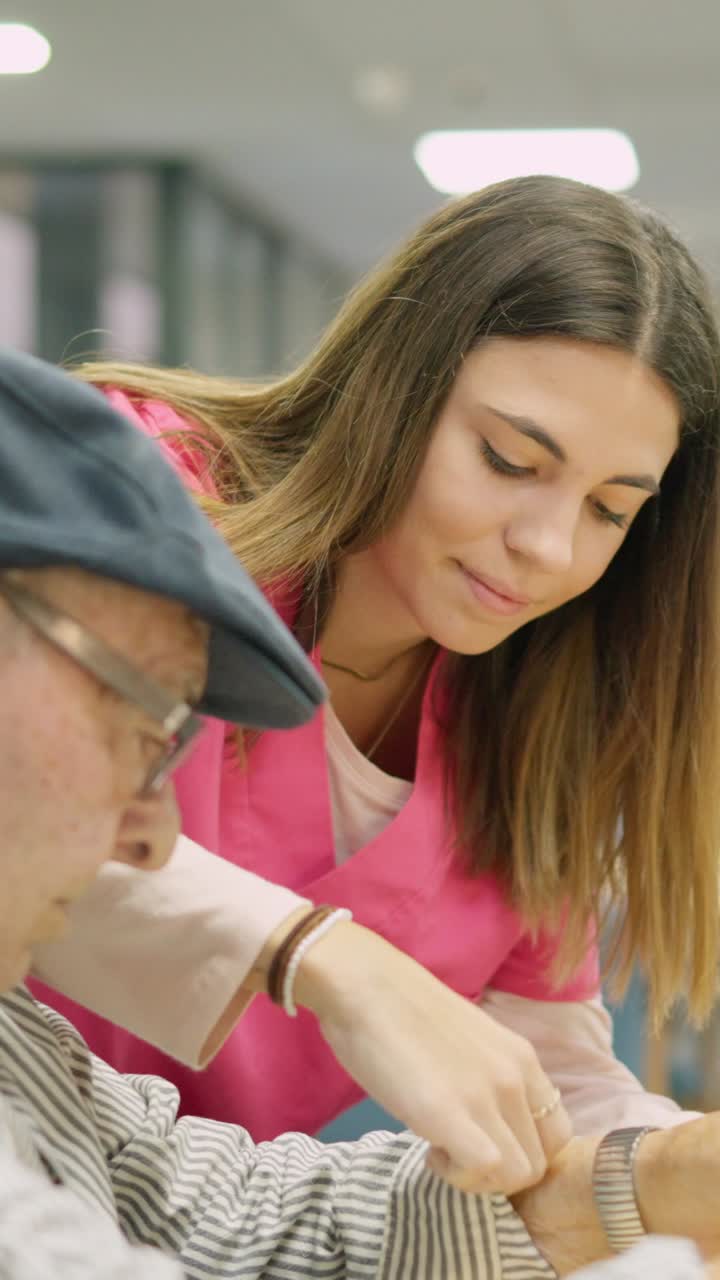 Compassionate Caregiver Assisting an Elderly Man