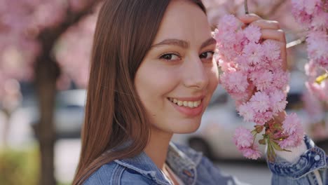 Woman enjoying cherry blossoms