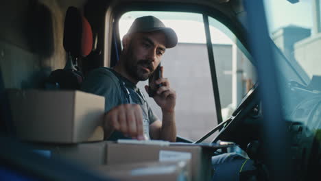 a delivery driver working inside his van
