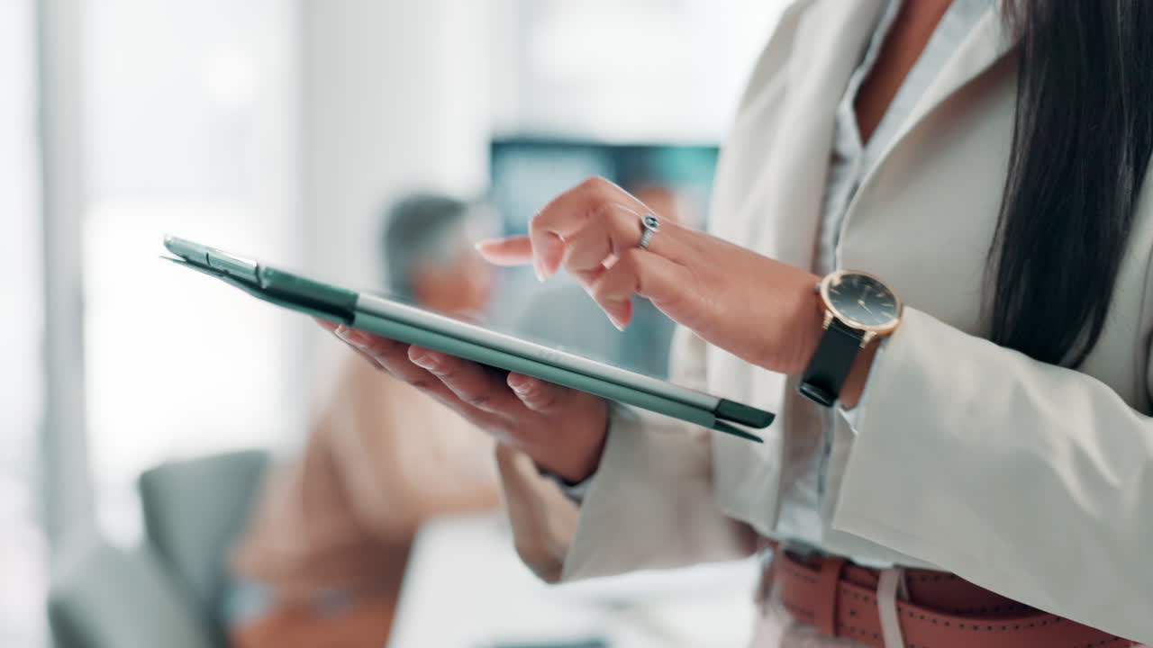 Woman using tablet in office environment