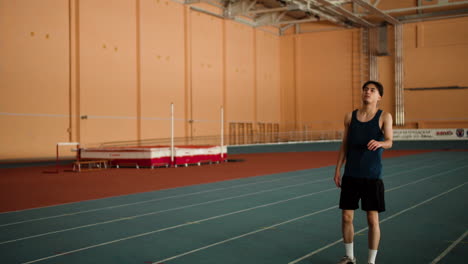 Young-man-running-indoors