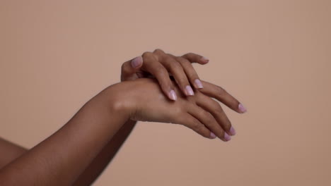 Woman Applying Lotion to Her Arms