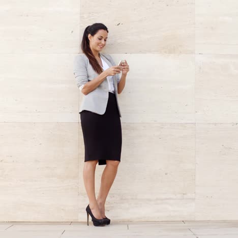 pretty young woman checking her mobile phone