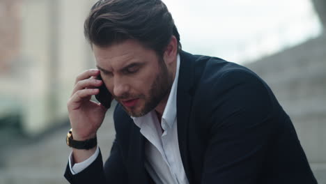 man using mobile phone outdoors