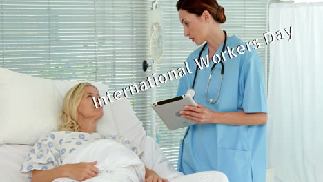 animation of international workers day over caucasian female doctor talking with patient