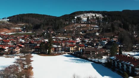 winter drone shot of chiemsee village, bavaria, germany