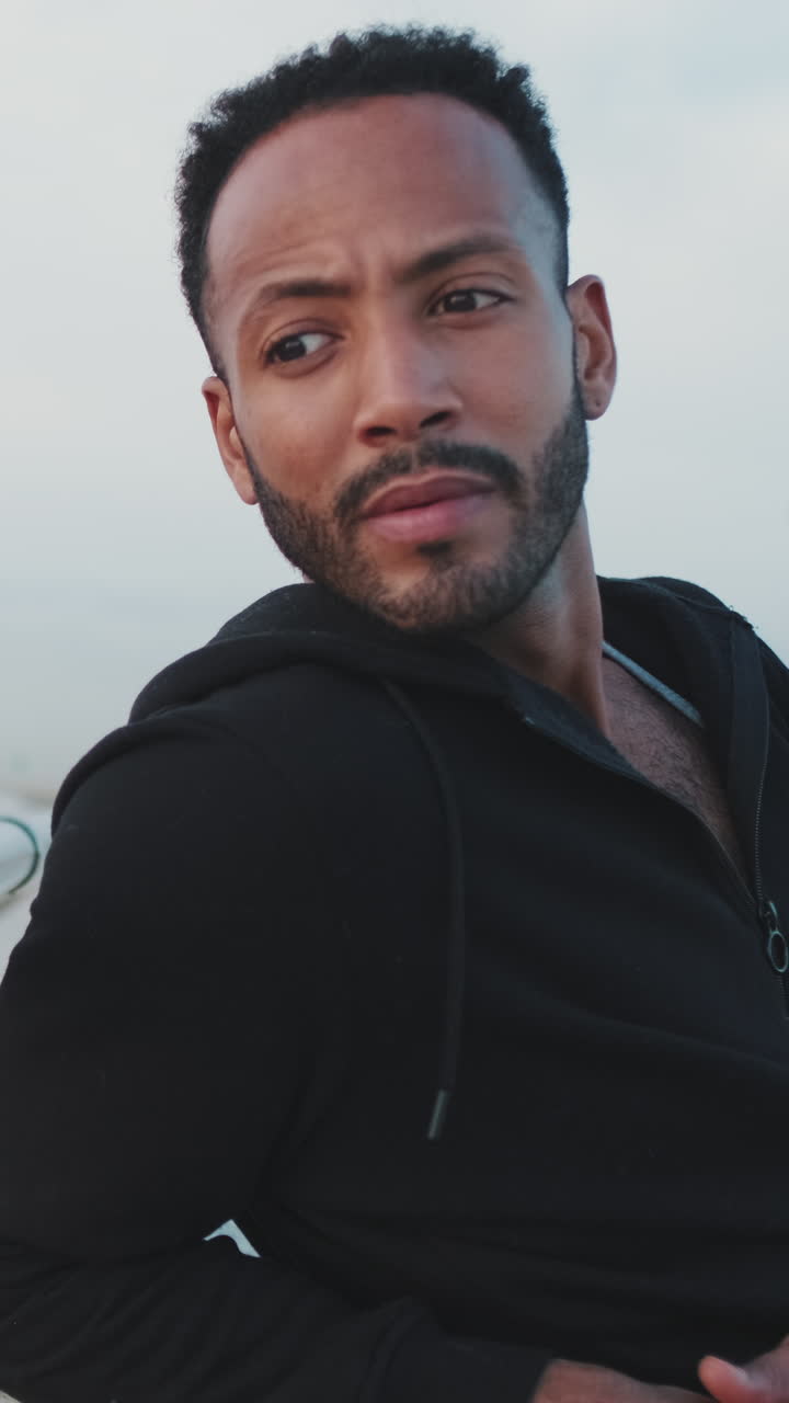 Portrait of a man in a black hoodie