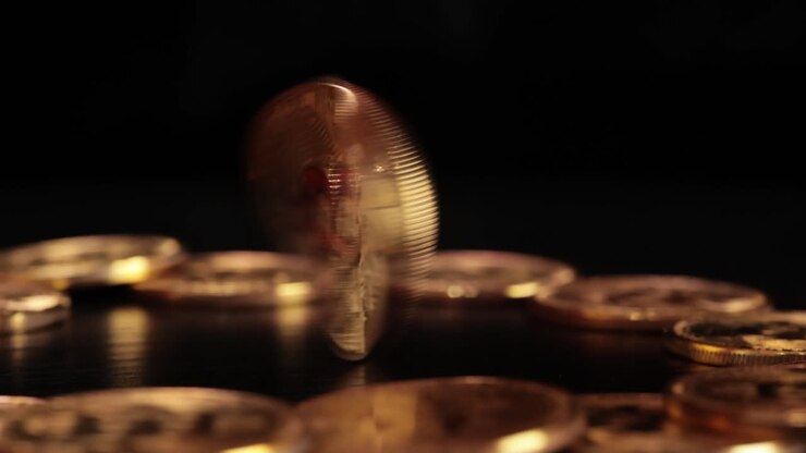 Gold Bit Coin BTC Cryptocurrency Coins on a black background. Bitcoin is a worldwide cryptocurrency and digital payment system called the first decentralized digital currency.