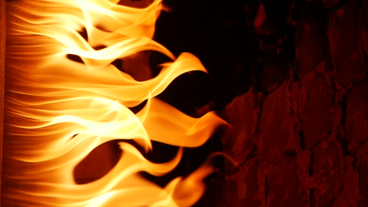 Fiery Flames Against Brick Wall