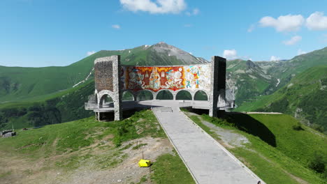 aerial view of russia-georgia friendship monument at daytime in gudauri, georgia