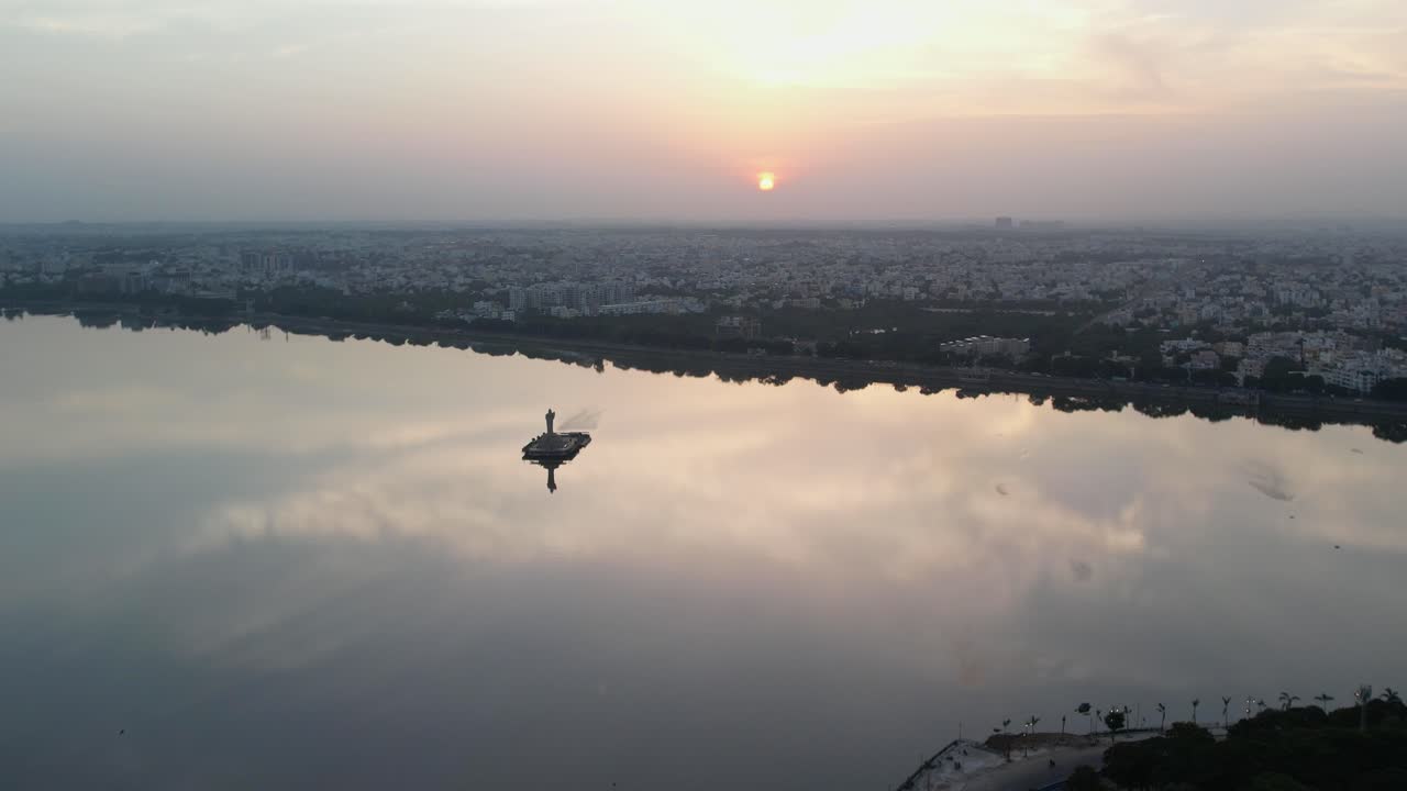 A beautiful sunrise over the Indian city of Hyderabad cinematic footage of Hyderabad's most famous area, Hussain Sagar Lake
