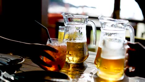 two people enjoying drinks at a table