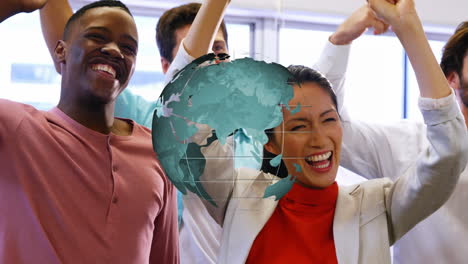 animation of rotating globe over happy diverse colleagues celebrating at casual office meeting