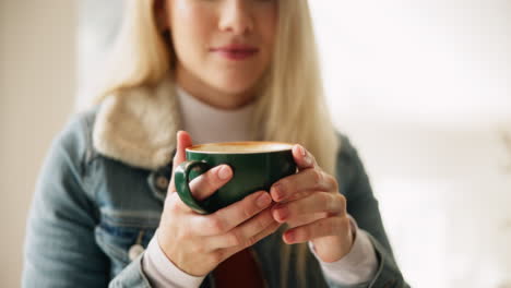 a woman enjoys her coffee
