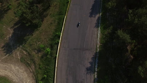 aerial view motorcyclist rider driving on race track. moto competition