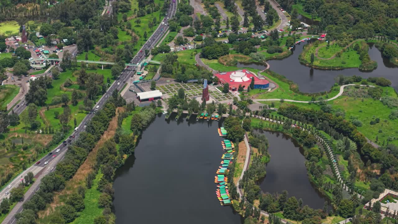 Drone footage of Xochimilco Ecological Park, a telephoto shot on a sunny day in Mexico City