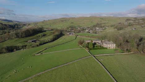 establishing drone shot of stainforth yorkshire dales fields and landscape