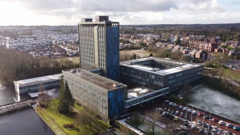 Pilkingtons-glass-head-quarters-blue-high-rise-business-office-park-aerial-orbiting-townscape-view