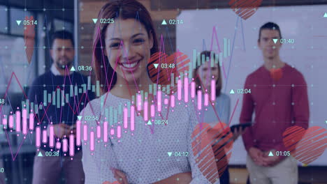 animación de números cambiantes, gráficos e íconos de corazón sobre diversos compañeros de trabajo de pie en la oficina