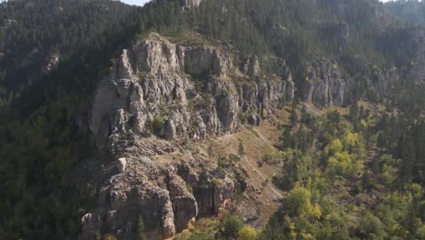 drone flying towards canyon edge in spearfish canyon