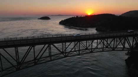 Drone-shot-of-cars-driving-across-Deception-Pass