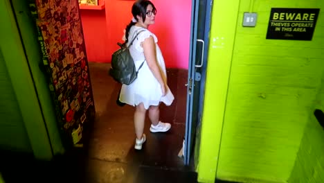 Woman entering into the alternative Vintage Market in Brick Lane, Shoreditch