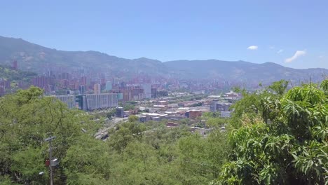 beautiful sliding shot showing trees and hills of medellin