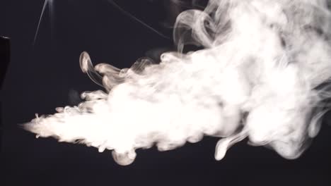 white smoke squirting and floating in space