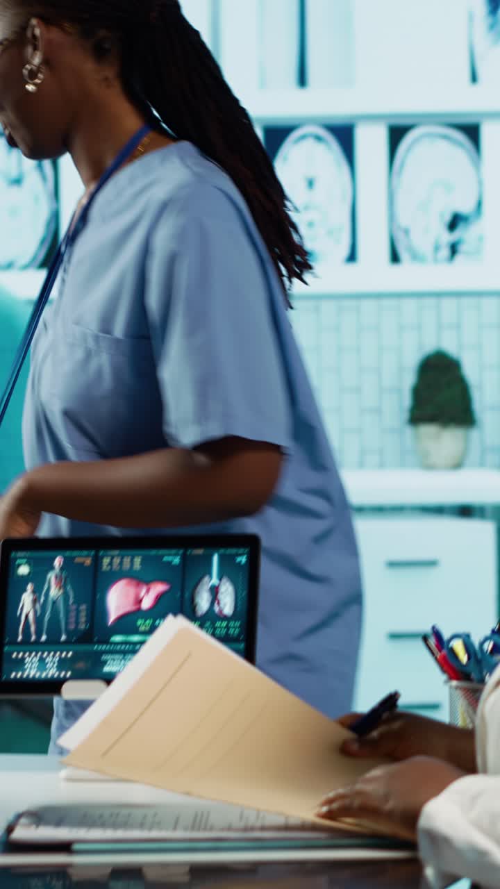 Medical Professionals Reviewing Digital Anatomy Data and Patient Documents