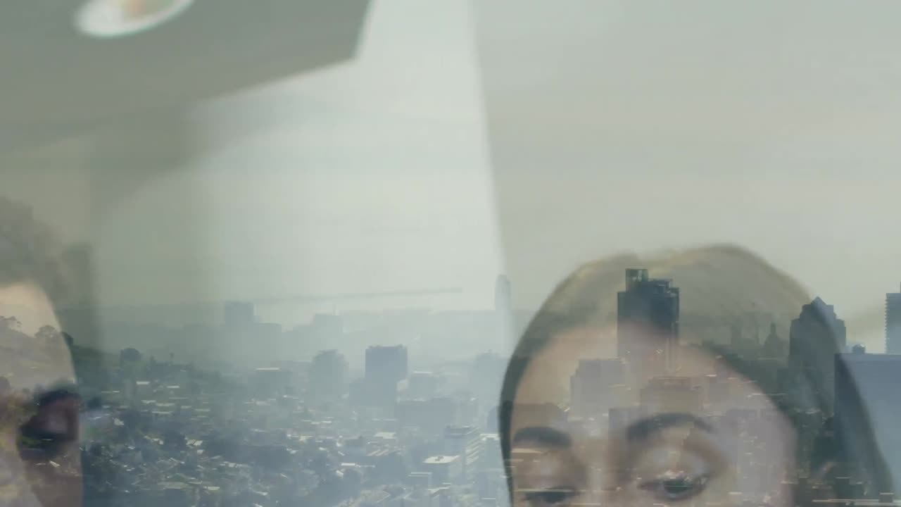 Animation of cityscape over diverse business people in office