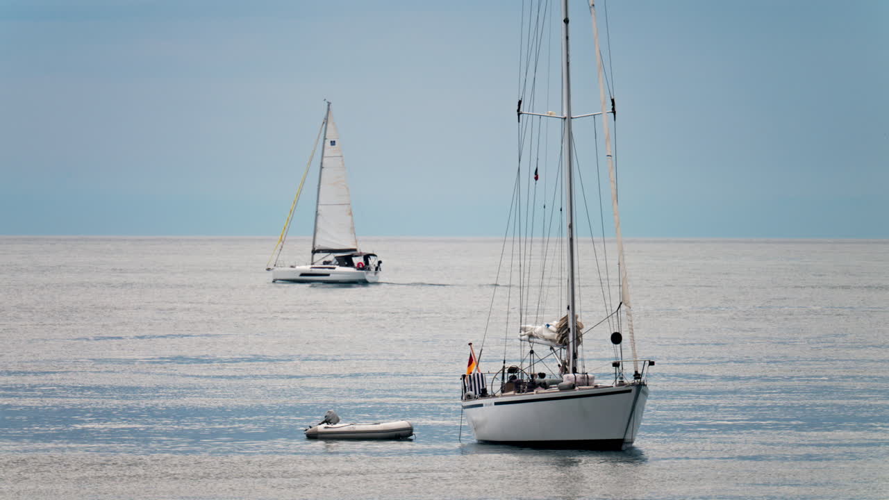 View of white boats floating on the Mediterranean Sea in daylight