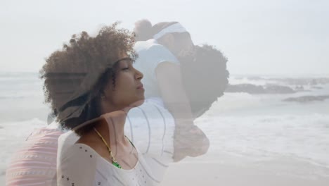 animation of african american parents and daughter playing on beach over woman meditating on beach