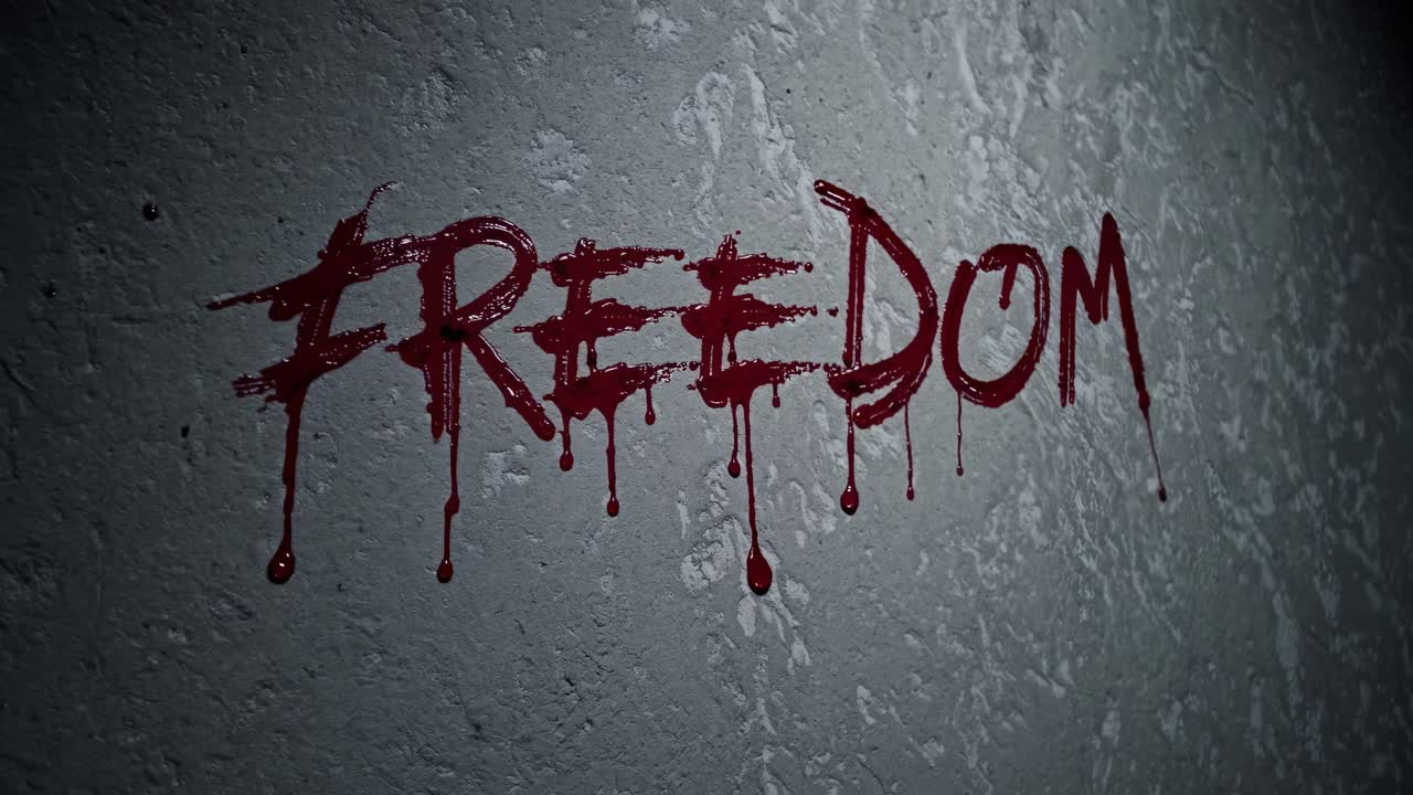 Blood dripping from the word freedom on a gray wall powerfully conveys a message of sacrifice, highlighting the intense struggle for liberty and the ongoing fight against oppression