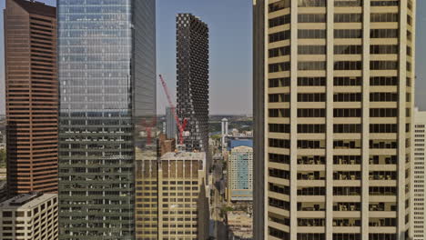 Calgary-AB-Canada-Aerial-v34-drone-fly-in-between-skyscrapers-at-Downtown-Commercial-district-above-7-Ave-SW-towards-East-Village-capturing-urban-cityscape---Shot-with-Mavic-3-Pro-Cine---July-2023