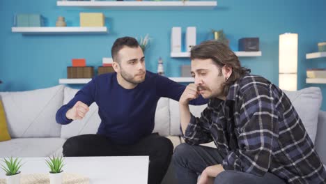 the sad man is supported and uplifted by his best male friend.