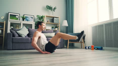 man doing leg raises at home