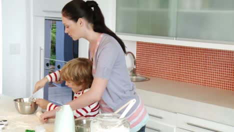 mother cooking with her son