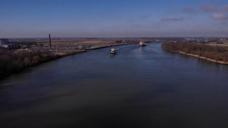 freight ship navigates into a river