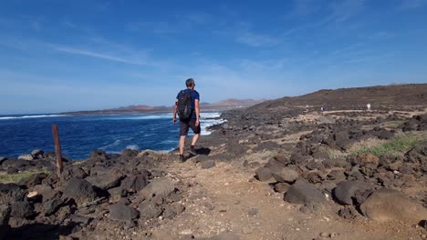 hiking at the wild coast of lanzarote sea rocks