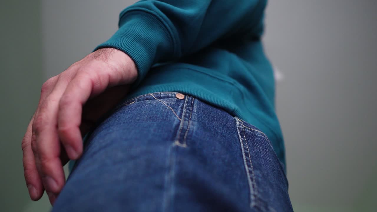 Person Checks on His Cell phone, Takes out His Smartphone from Jeans Pocket and the Back in