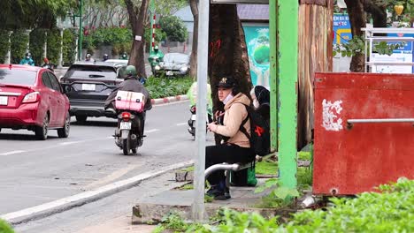 motorbikes and cars on a busy street