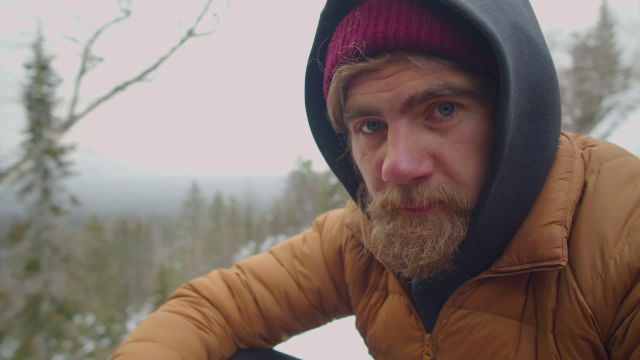 Portrait of Male Tourist in Mountains on Winter Day
