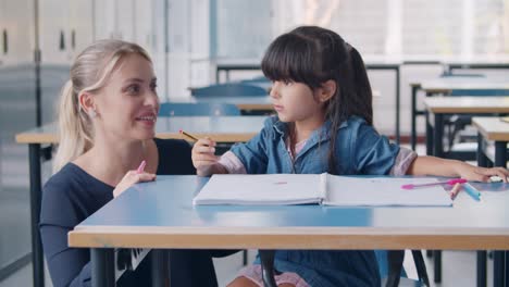 happy female school teacher and latin schoolgirl talking