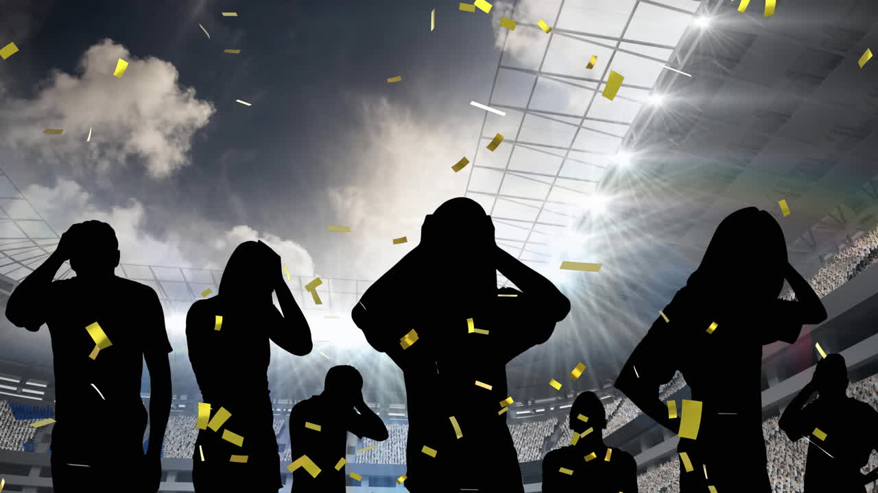 황금 콘페티가 실망한 팬들과 스포츠 경기장의 실루 ⁇  위로 떨어지고 있습니다.