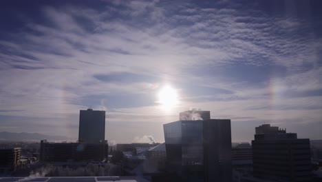 Parhelion-Sun-Dogs-forming-in-freezing-conditions-over-Anchorage-Skyline,-time-lapse