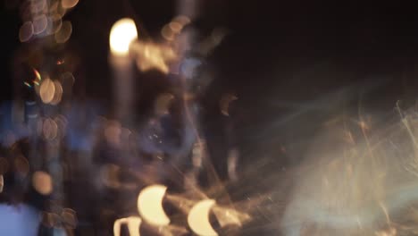 decorative table setting pan with candle lights at a wedding reception.