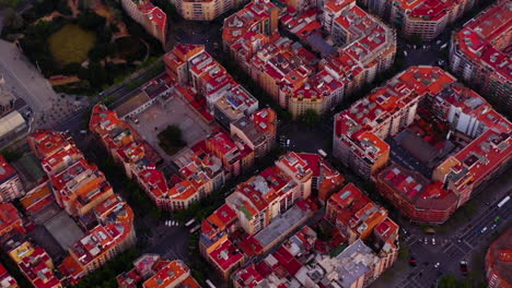 Aerial-view-of-square-blocks-in-new-quarter-of-Barcelona-at-sunrise,-Spain