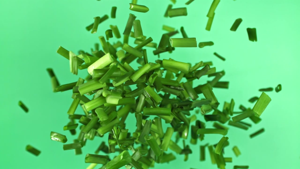 Fresh Chopped Green Chives Falling in Slow Motion