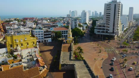 aerial orbiting shot of clock tower monument in cartagena's old city